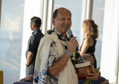 Kahu Kordell Kekoa, a Hawaiin male, speaking into a microphone